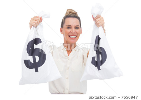 Smiling businesswoman carrying cash bags 7656947
