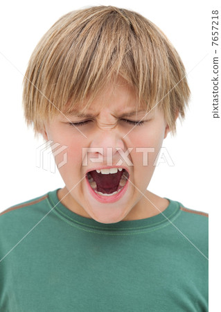 Furious little boy shouting with eyes closed Furious little boy shouting with eyes closed 7657218