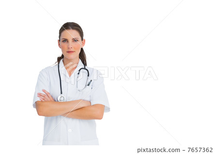 Unsmiling nurse with arms crossed 7657362