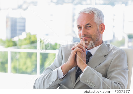 Happy businessman thinking 7657377