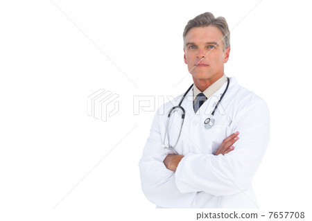 Serious doctor with arms crossed 7657708