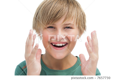 Suprised blonde boy with hands up smiling Suprised blonde boy with hands up smiling 7657730