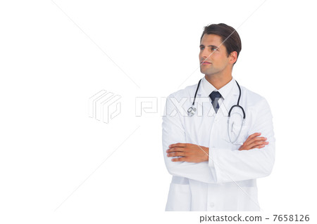 Smliing doctor with arms crossed looking up 7658126