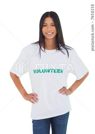 Cheerful woman wearing volunteer tshirt 7658158