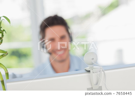 Happy designer having a video chat 7658445
