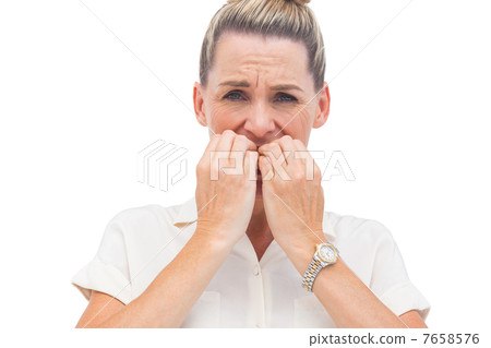 Businesswoman biting nails Businesswoman biting nails 7658576