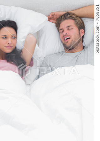 Brunette annoyed by the snoring of her husband 7658851