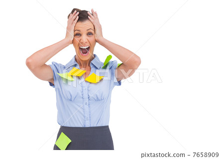 Businesswoman shouting with adhesive notes on her shirt 7658909