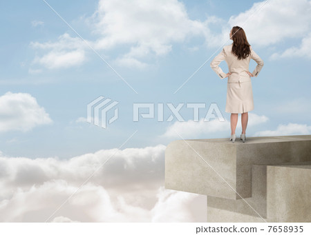 Businesswoman looking at the horizon over the clouds 7658935