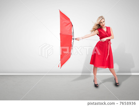 Beautiful woman wearing red dress and holding umbrella 7658936