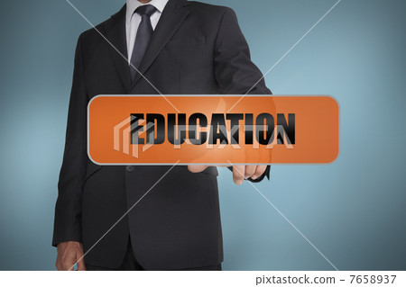 Businessman touching the word education 7658937