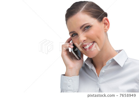 Smiling business woman talking on mobile phone Smiling business woman talking on mobile phone 7658949