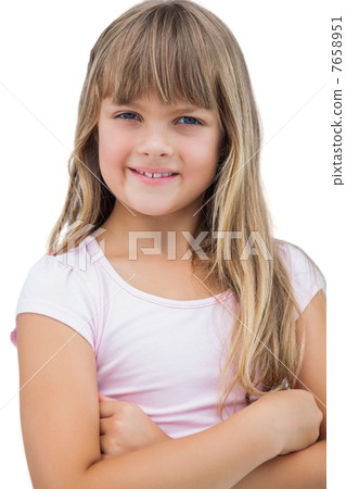 Beautiful little girl smiling with her arms crossed 7658951