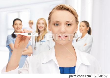 attractive female doctor with thermometer 7660482