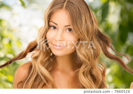 beautiful woman with green leaves 7660528
