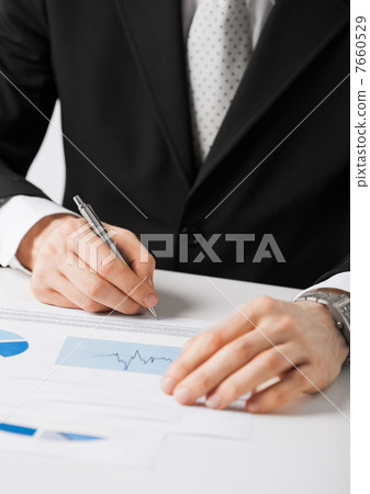 businessman working and signing paper 7660529