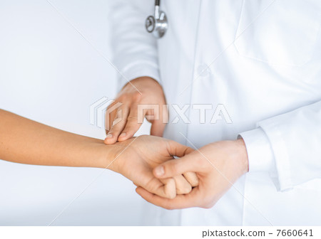 doctor measuring patient heart beat doctor measuring patient heart beat 7660641