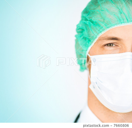 surgeon in medical cap and mask 7660806