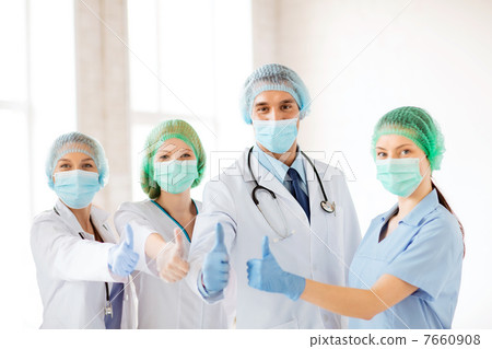 group of doctors in operating room 7660908