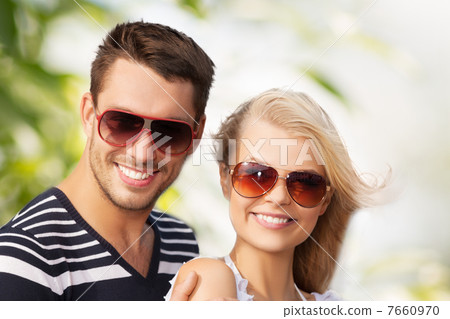 happy young couple in the woods happy young couple in the woods 7660970