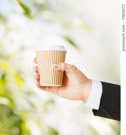man hand holding take away coffee man hand holding take away coffee 7660972