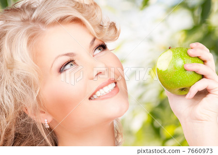 young beautiful woman with green apple young beautiful woman with green apple 7660973