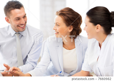 business team having discussion in office 7660982