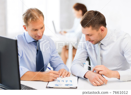 businessmen with notebook on meeting 7661012