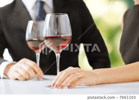 engaged couple with wine glasses 7661103