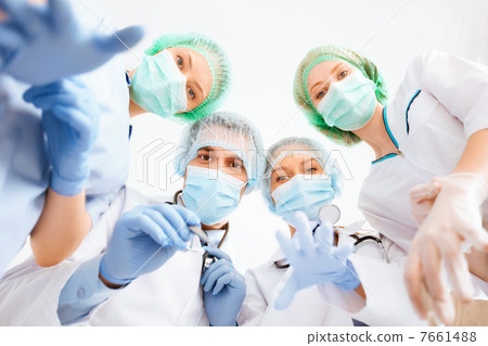 group of doctors in operating room 7661488