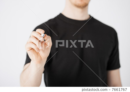 man writing something in the air 7661767