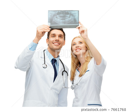 two doctors looking at x-ray 7661768