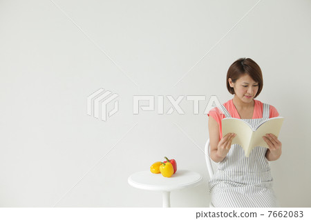 A woman reading a book A woman reading a book 7662083