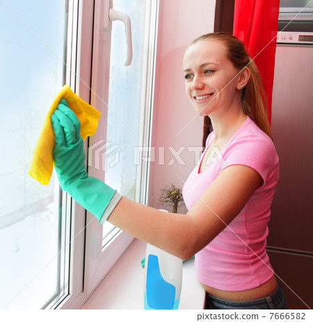 Woman cleaning window 7666582