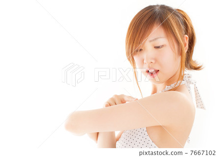 Pretty girl in swimsuit worrying sunburn 7667102