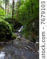 A small waterfall in the forest 7679103