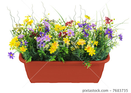 Composition of artificial garden flowers in brown flowerpot isol Composition of artificial garden flowers in brown flowerpot isol 7683735