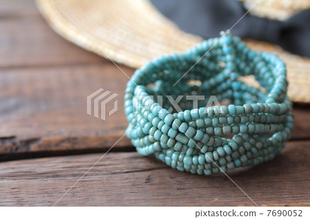 Light blue bead bracelet and straw hat - Summer image Light blue bead bracelet and straw hat - Summer image 7690052
