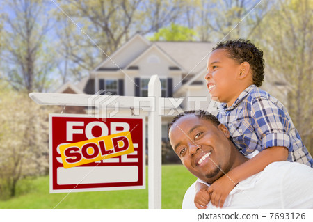 Mixed Race Father and Son In Front of Real Estate Sign and House 7693126