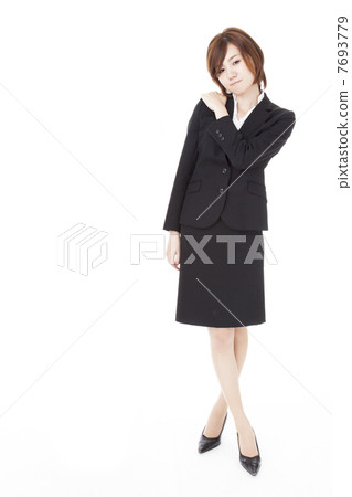 Young business woman suffering from stiff shoulders Young business woman suffering from stiff shoulders 7693779