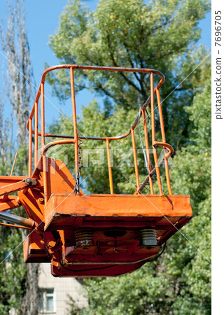 Hydraulic platform cradle  on  green tree background 7696705