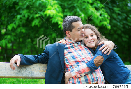 Happy couple outdoors, hugging 7697265