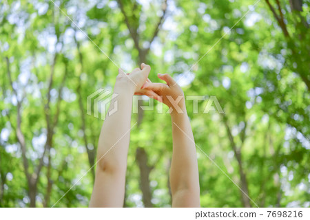 A woman stretching backwards 7698216