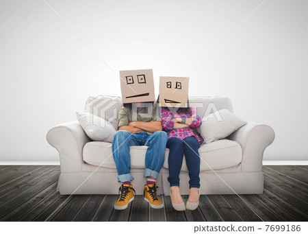Couple wearing humorous boxes on their head Couple wearing humorous boxes on their head 7699186