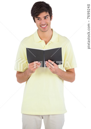 Smiling student holding a notebook 7699248