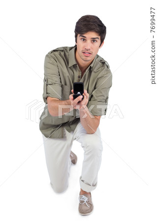 Surprised man making a marriage proposal Surprised man making a marriage proposal 7699477