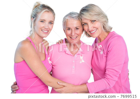 Embracing women wearing pink tops and ribbons for breast cancer Embracing women wearing pink tops and ribbons for breast cancer 7699515