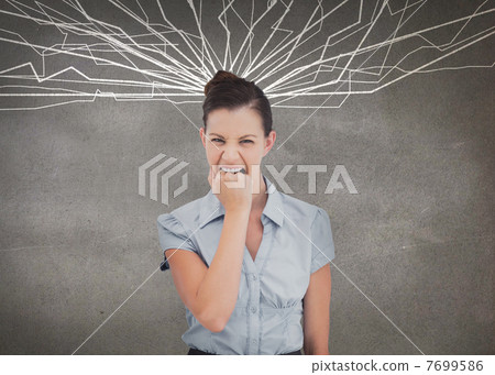 Attractive businesswoman biting her fist Attractive businesswoman biting her fist 7699586