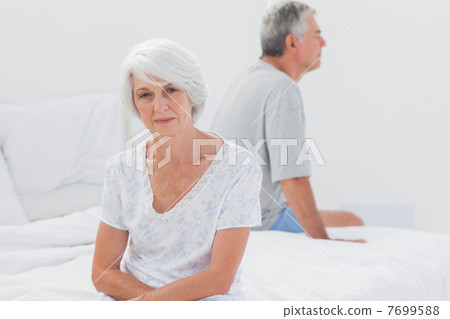 Woman sulking in bed during a conflict 7699588