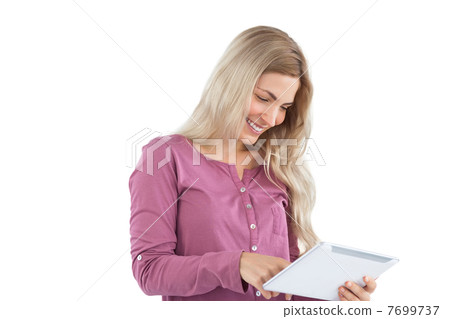 Woman using her tablet pc Woman using her tablet pc 7699737